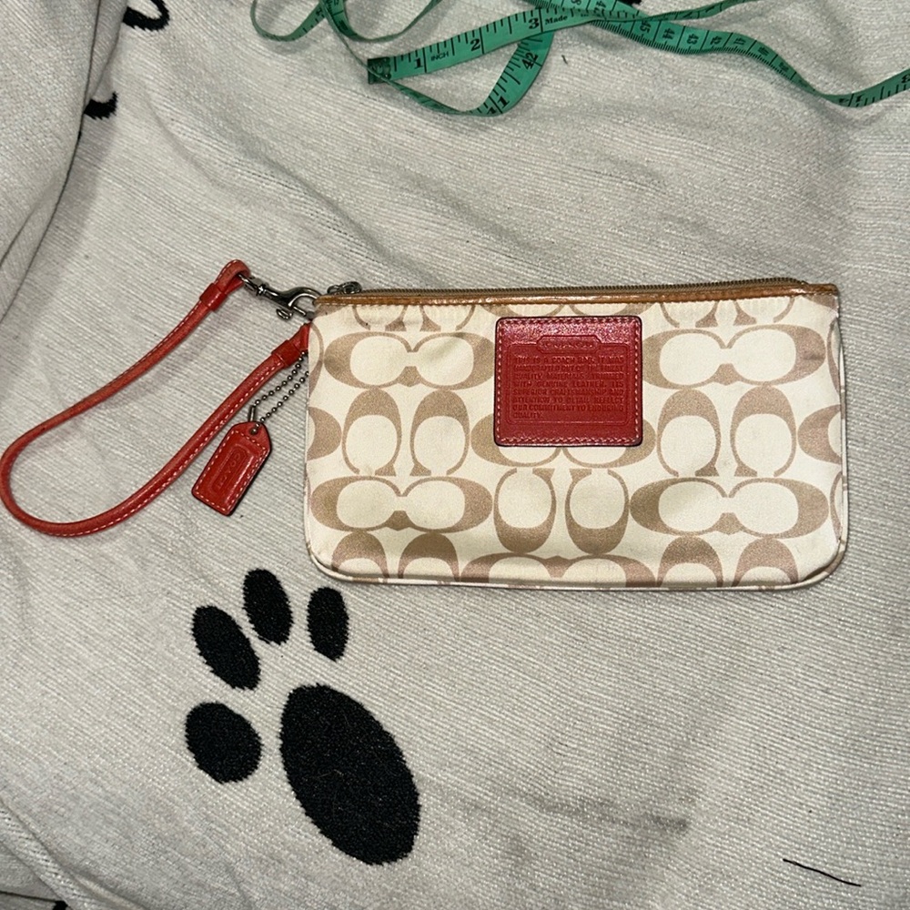 Coach cream and tan monogram nylon wristlet with leather trim and hang tag 🍊